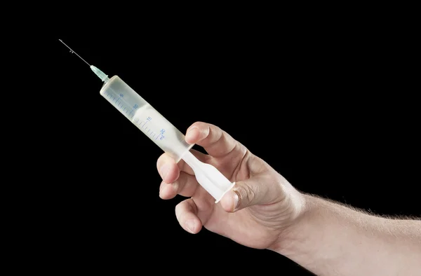 Large Syringe in hand — Stock Photo, Image