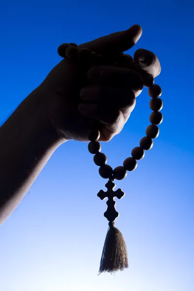 Rosary in hand — Stock Photo, Image