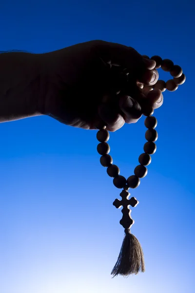 Rosary in hand — Stock Photo, Image