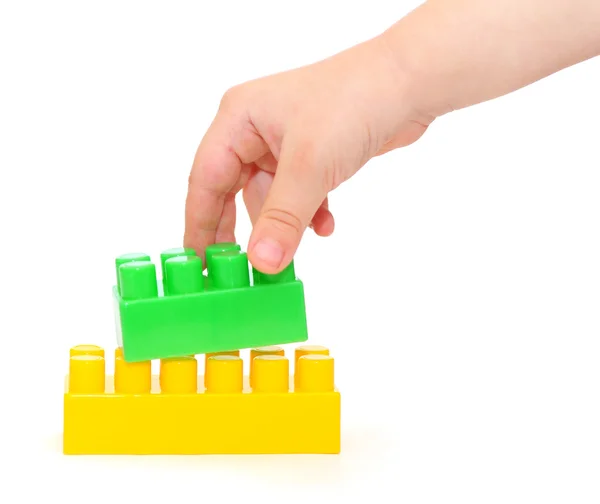 Color plastic blocks with hand — Stock Photo, Image