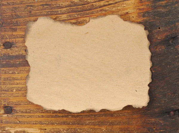 Старий папір на дерев'яній дошці — стокове фото