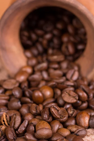 Ceramic jug with coffee beans — Stock Photo, Image