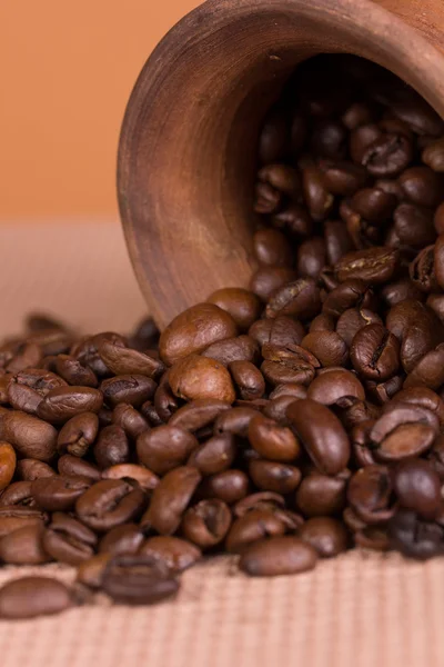 Ceramic jug with coffee beans — Stock Photo, Image