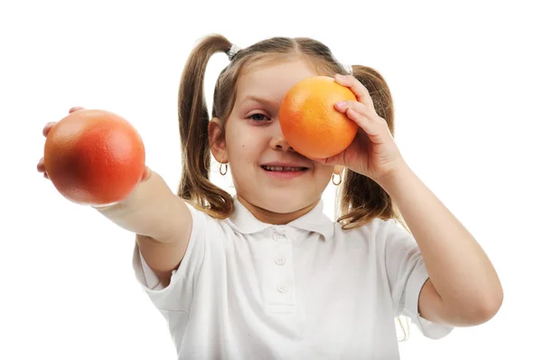 Meisje met sinaasappelen — Stockfoto