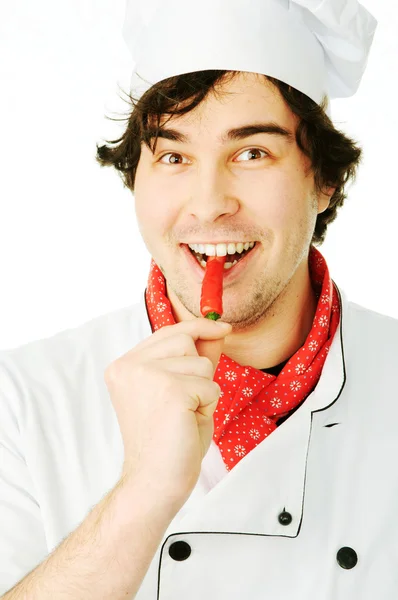 Chef in uniform holding hot chili pepper — Stock Photo, Image