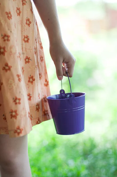 Child hands with a bucket in it — Stock Photo, Image