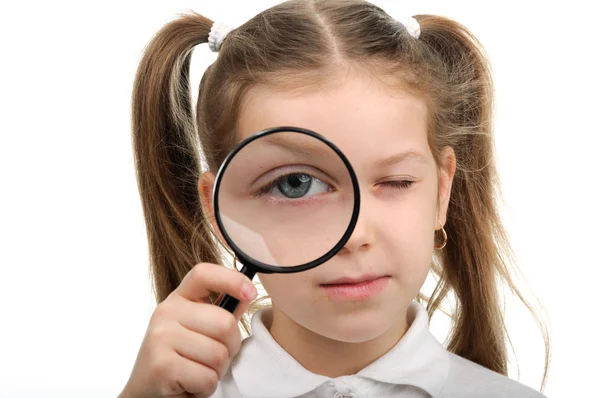 Girl with magnifying glass — Stock Photo, Image