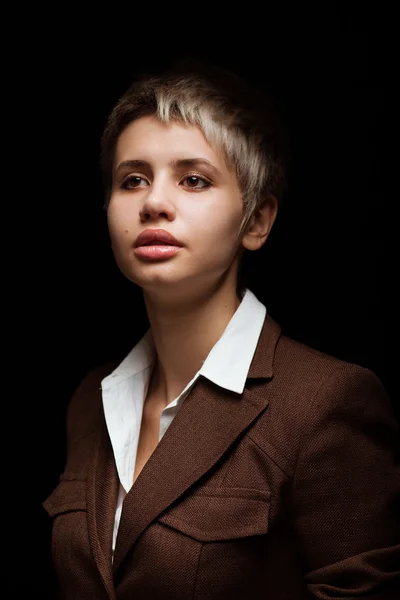 Young woman on a dark background — Stock Photo, Image