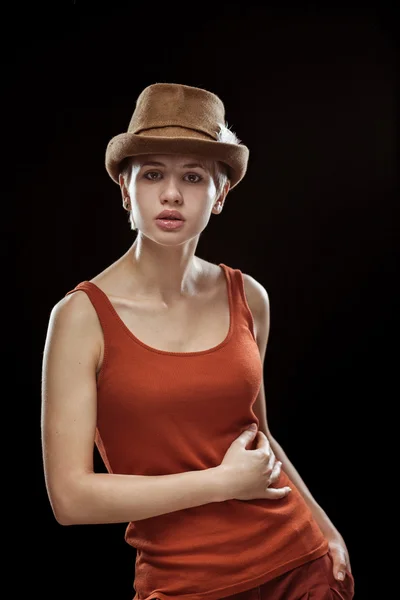 Young woman on a dark background — Stock Photo, Image