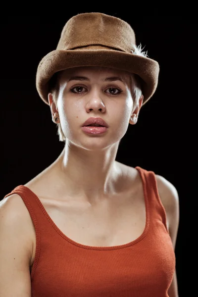 Young woman on a dark background — Stock Photo, Image