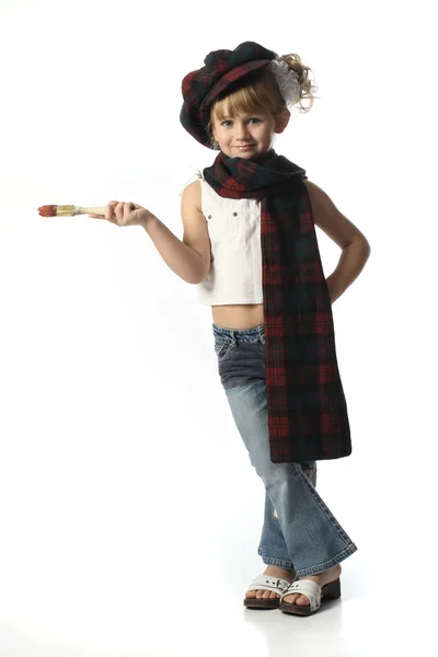 Красивая маленькая девочка с кисточкой — стоковое фото