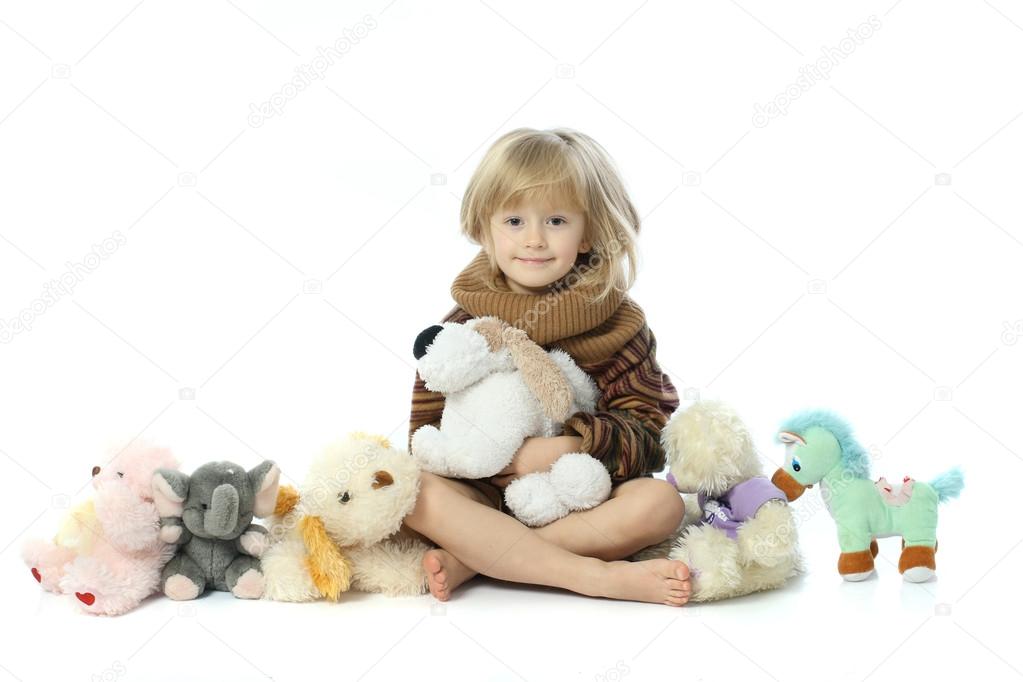 Little girl with plush toys
