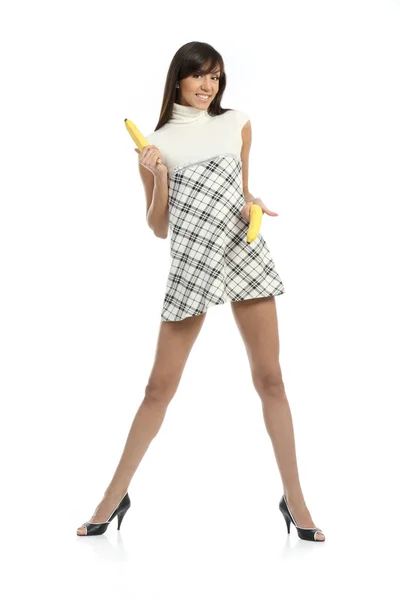 Junge Frau im Kleid mit Bananen — Stockfoto