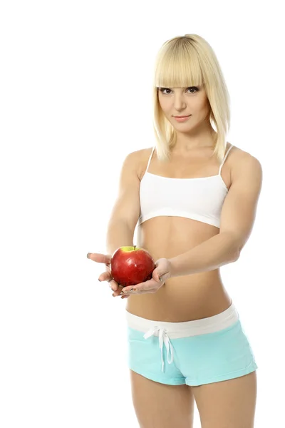 Atletische blond meisje met apple — Stockfoto