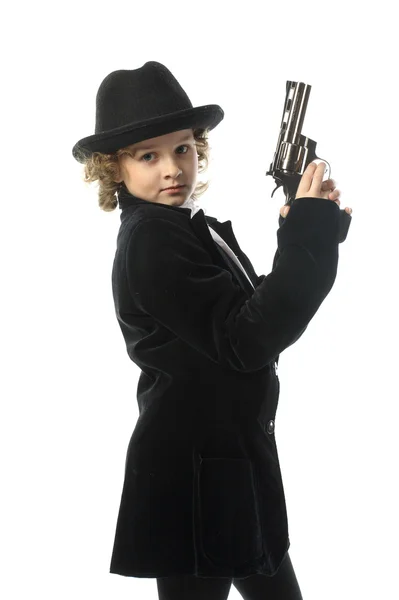 Teen girl in a hat with a gun — Stock Photo, Image