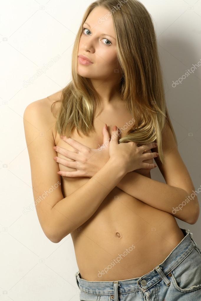 Charming naked girl in jeans