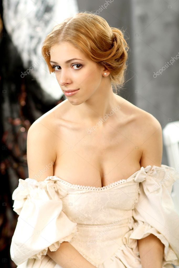 Portrait of attractive girl in vintage dress with a plunging neckline