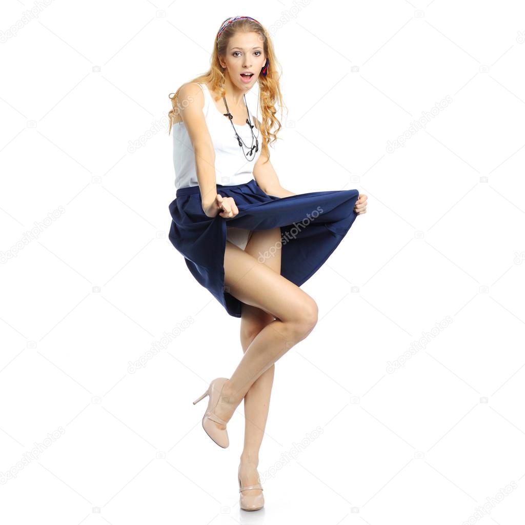 Surprised girl lifts her skirt.