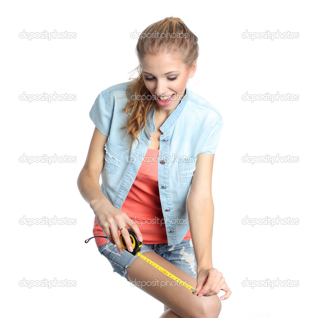 Girl ready to measure anything with a tape measure.