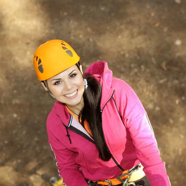 Beautiful girl climber climbs up the stairs — Stock Photo, Image