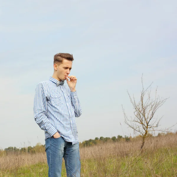 Sad hipster guy smokes — Stock Photo, Image