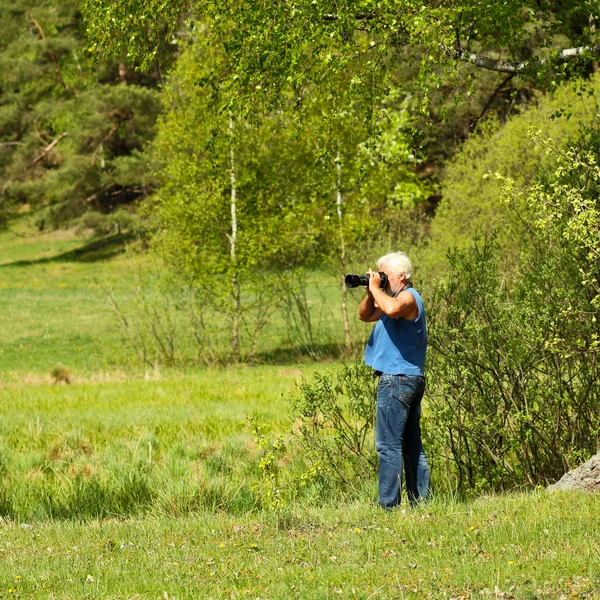 Muž fotograf — Stock fotografie