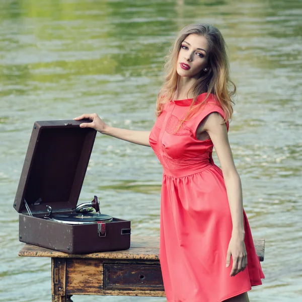 Stylish girl with retro gramophone — Stock Photo, Image