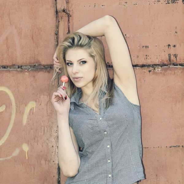 Beautiful blonde girl with lollipop — Stock Photo, Image