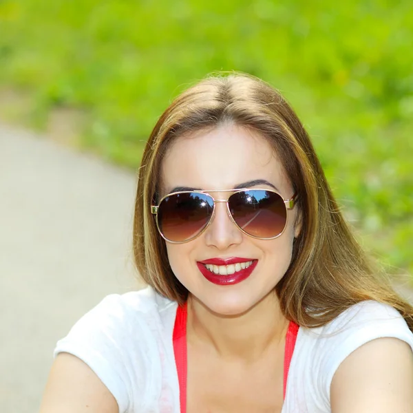 Sexy brunette woman in sunglasses Stock Image