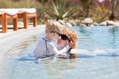 Mother and her son in the pool