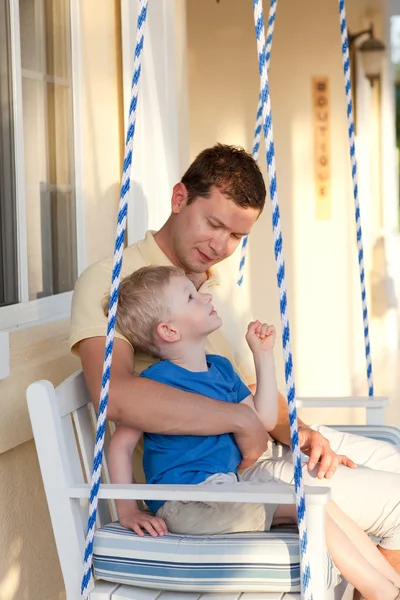 Father and son on a swing — Stock Photo, Image