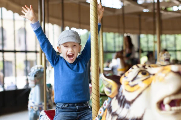 Boy at carousel — Stock Photo, Image