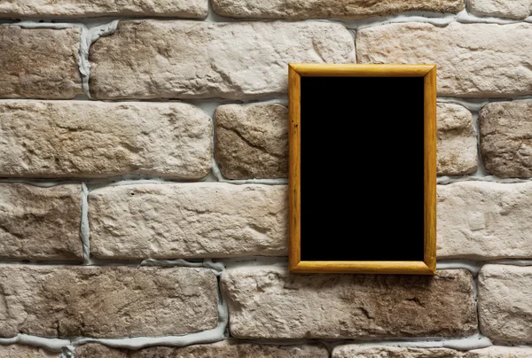 Photo frame on brick wall — Stock Photo, Image