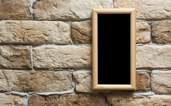 Photo frame on brick wall — Stock Photo, Image