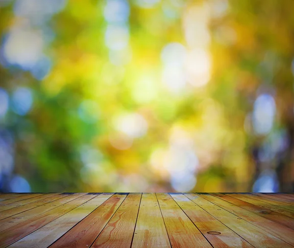 Bright bokeh and wooden floor — Stock Photo, Image