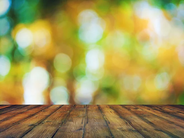 Bokeh lumineux et plancher en bois — Photo