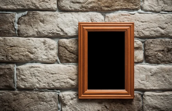 Photo frame on brick wall — Stock Photo, Image