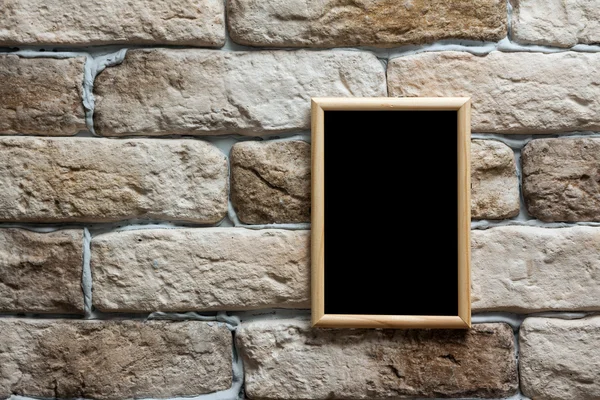 Moldura de foto na parede de tijolo — Fotografia de Stock
