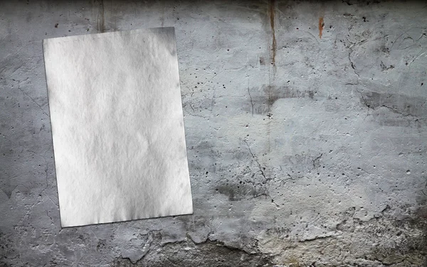 Paper on dirty wall — Stock Photo, Image