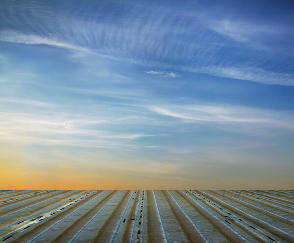 blue sky and metallic floor