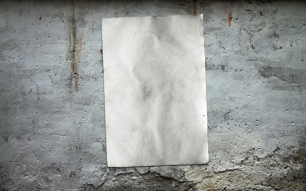 Paper on dirty wall — Stock Photo, Image
