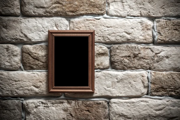 Photo frame on brick wall — Stock Photo, Image