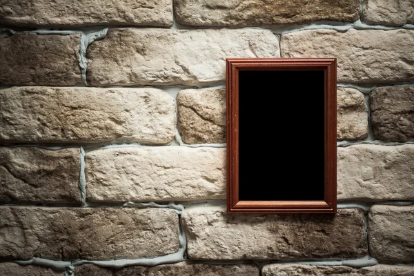 Photo frame on brick wall — Stock Photo, Image