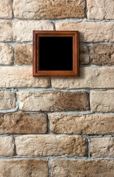 Photo frame on brick wall — Stock Photo, Image