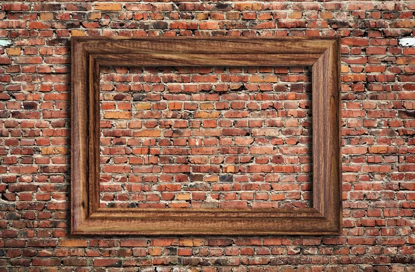 Photo frame on brick wall — Stock Photo, Image