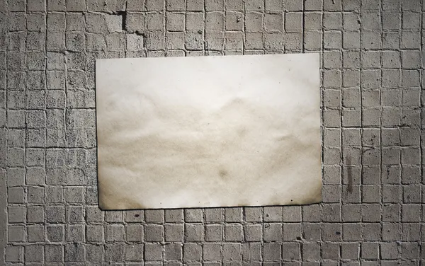 Paper on tile wall — Stock Photo, Image