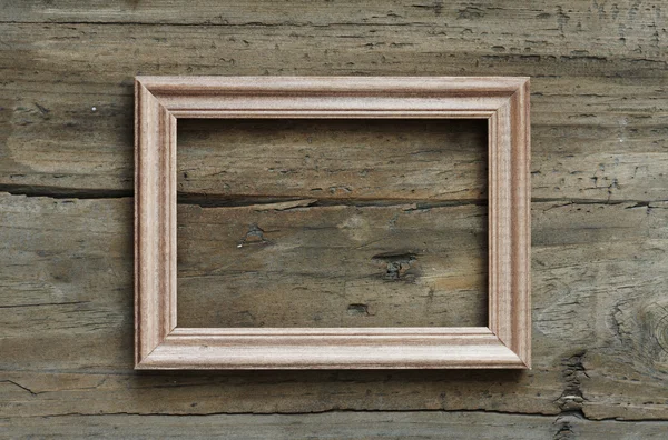 Fotoframe op houten muur — Stockfoto