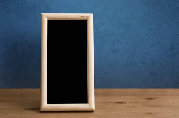 Wooden Photo Frame Table Blue Wall — Stock Photo, Image