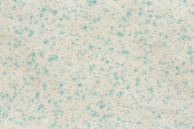 Eski kağıt dokusunda kar taneleri olan eski bir Noel arkaplanı