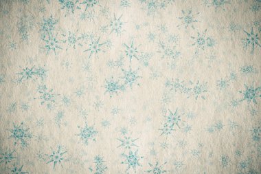 Eski kağıt dokusunda kar taneleri olan eski bir Noel arkaplanı